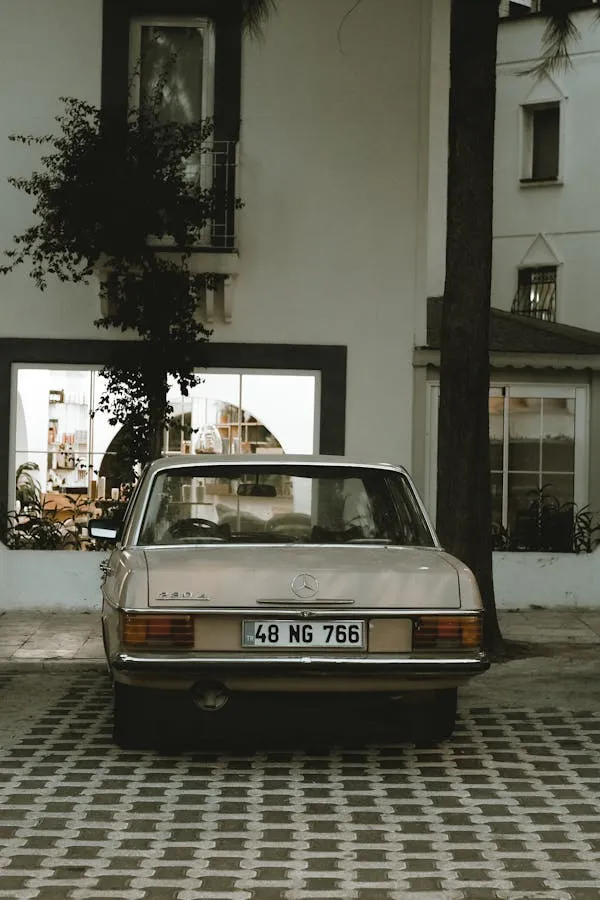Rear of Vintage Benz Parked in European Courtyard image