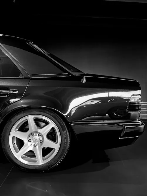 Rear Quarter View of Classic Black Mercedes with Alloy Wheels