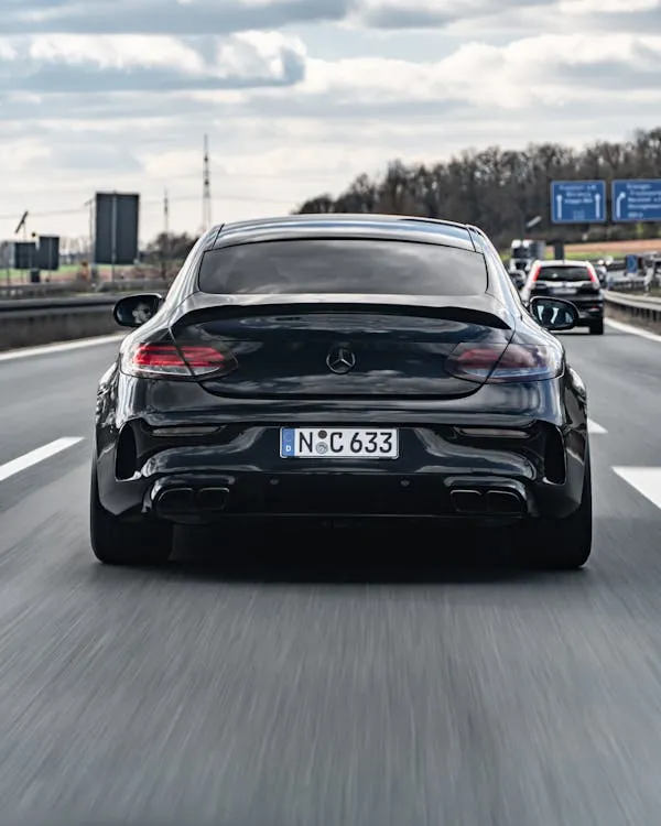 Rear Shot of Black Mercedes Driving on Busy Highway HD