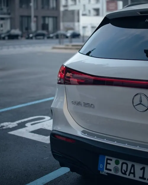 Rear Side of White Mercedes SUV with Parking Lines image