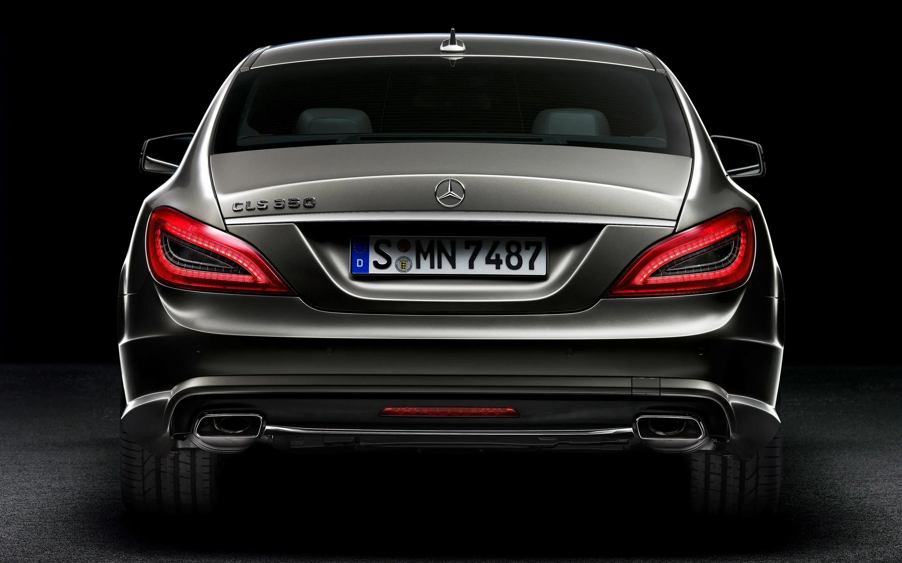 Rear View Mercedes Benz Black Sedan with Studio Lighting