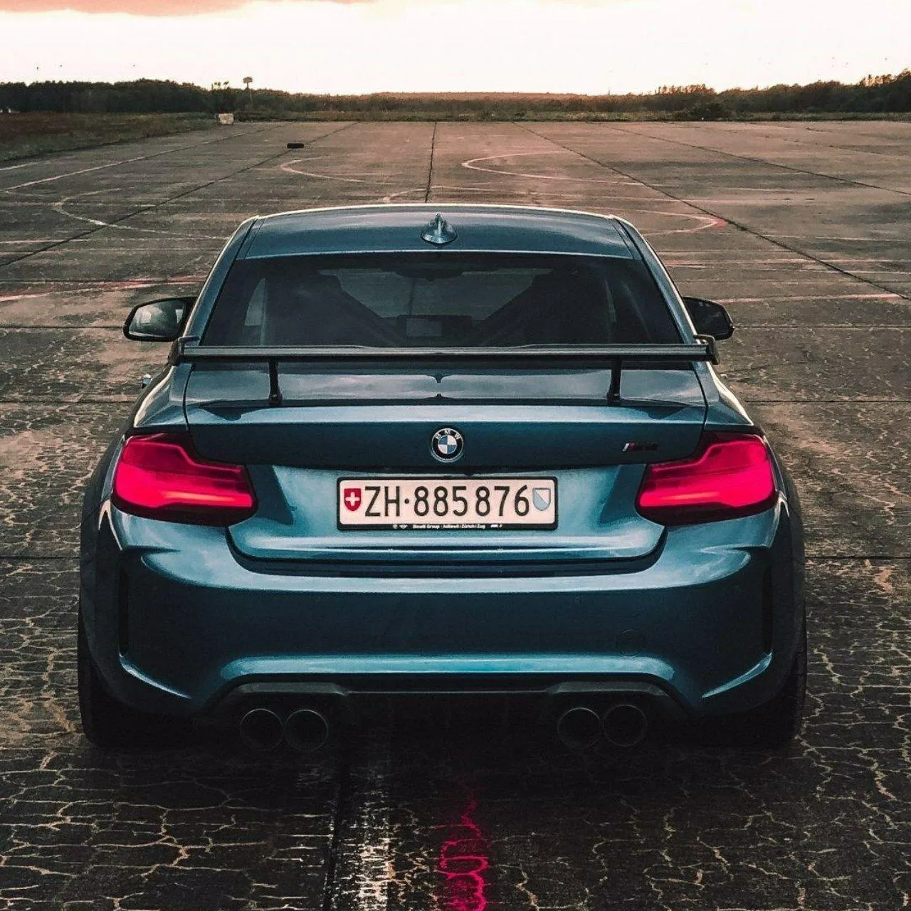 Rear View of a Dark Bmw Sports Car Parked Wallpaper