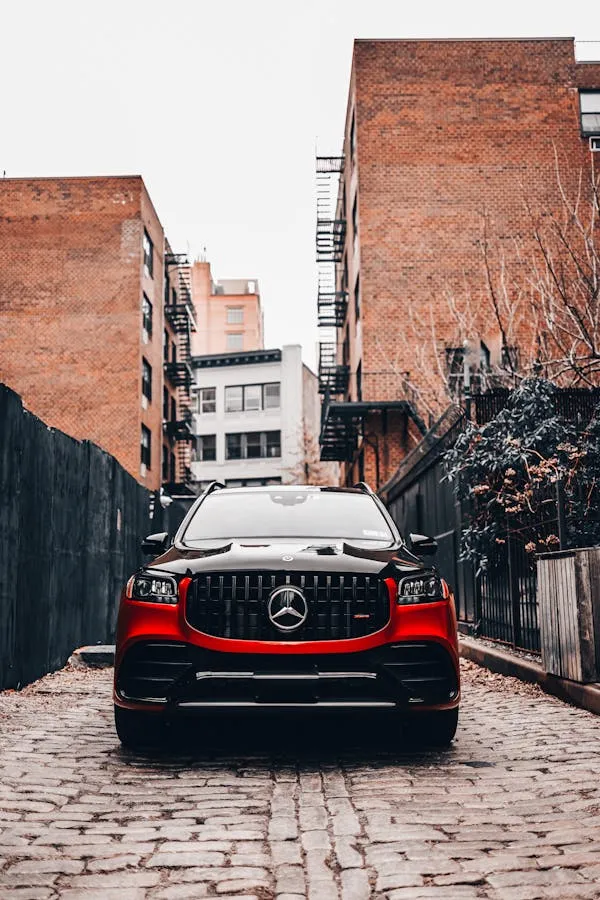 Rear View of Black Mercedes Benz on Brick Street Wallpaper