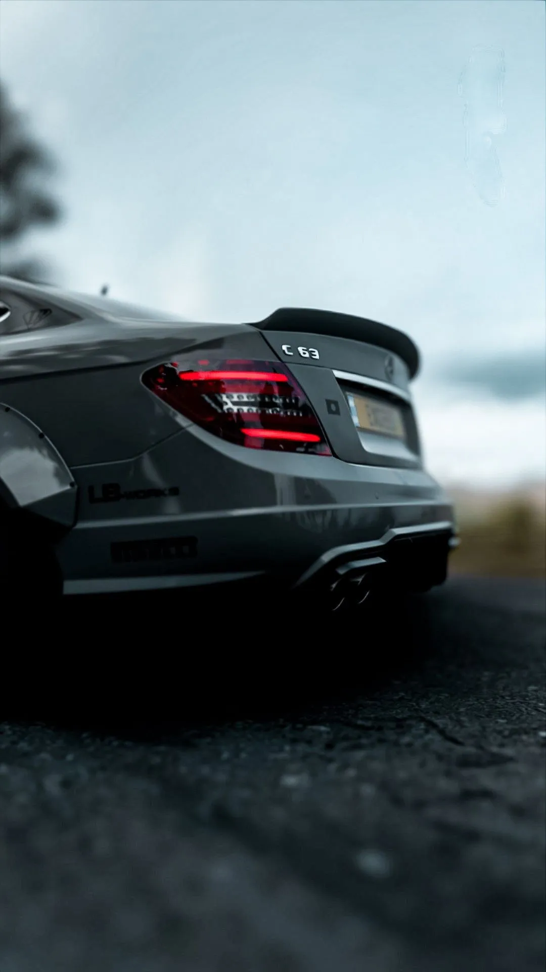 Rear View of Black Mercedes Benz on Road with Spoiler