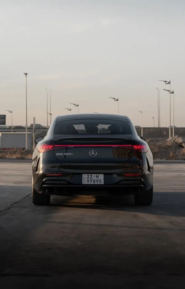 Rear View of Black Mercedes Benz SUV Parked on City Street