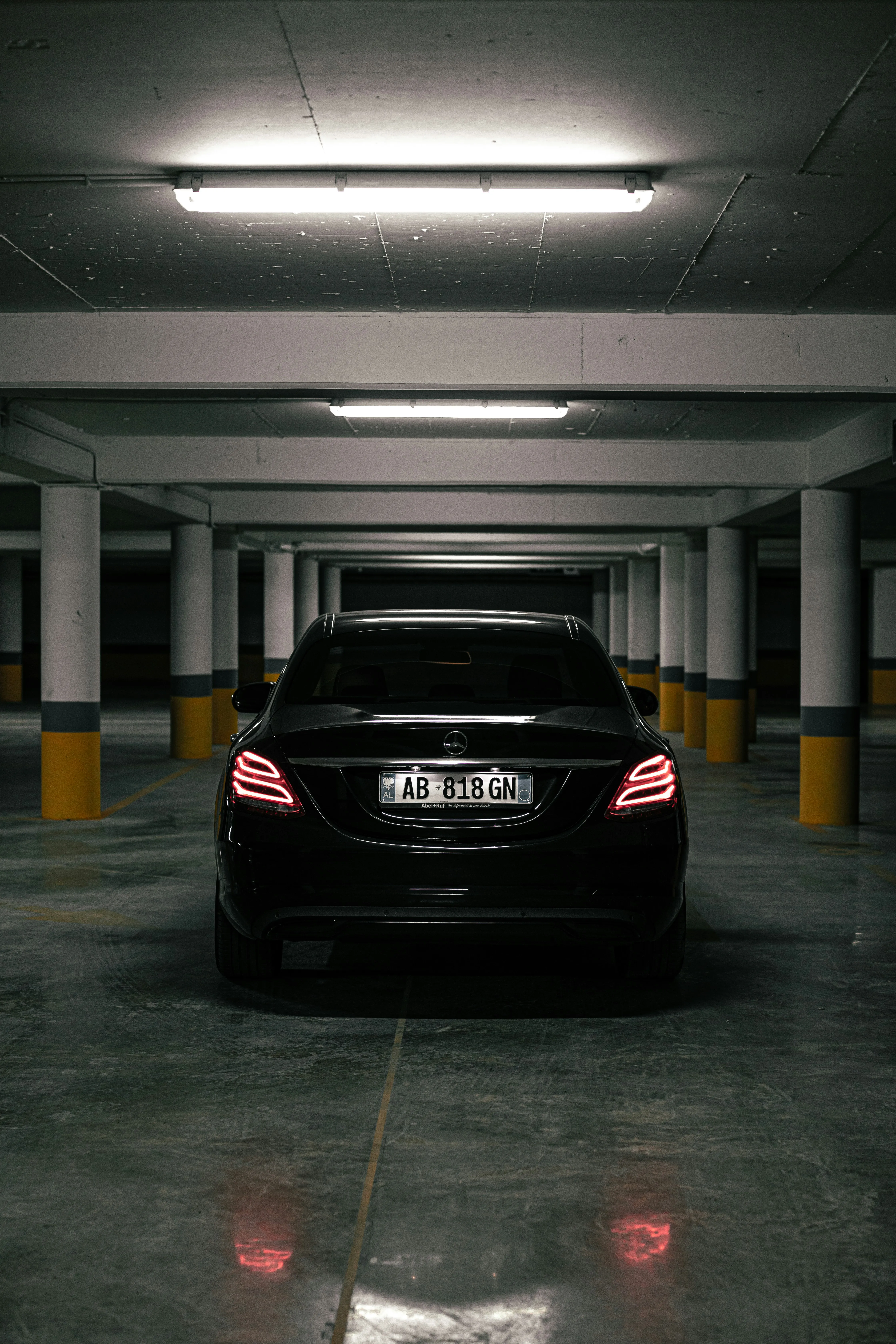 Rear View of Black Mercedes in Underground Lot Wallpaper