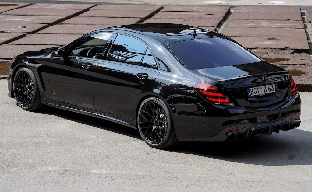 Rear View of Black Mercedes Sedan Parked on Pavement