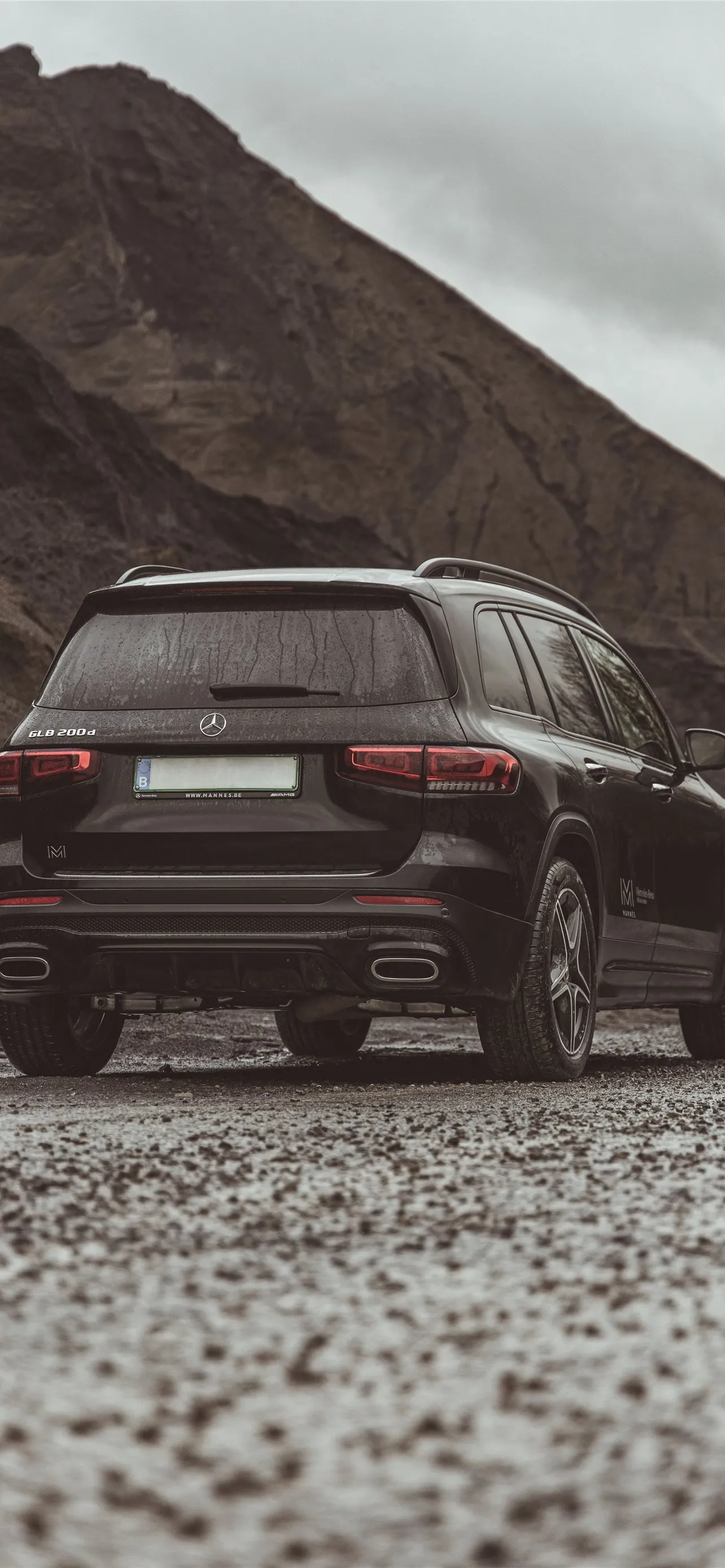 Rear View of Black Mercedes SUV in Rocky Mountain Area