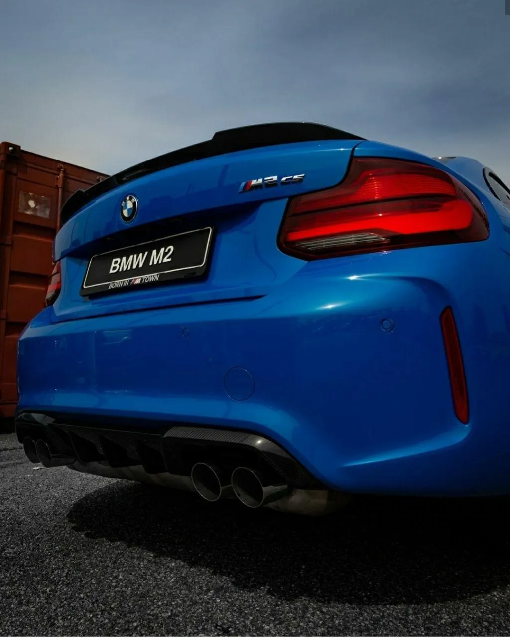Rear View of Blue Bmw Car Parked on Street Wallpaper