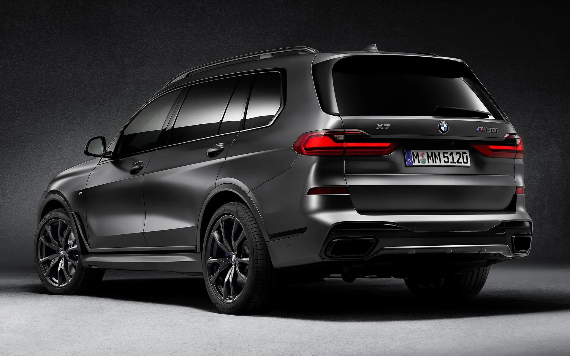 Rear View of Bmw Suv Parked in a Low Light Indoor Space