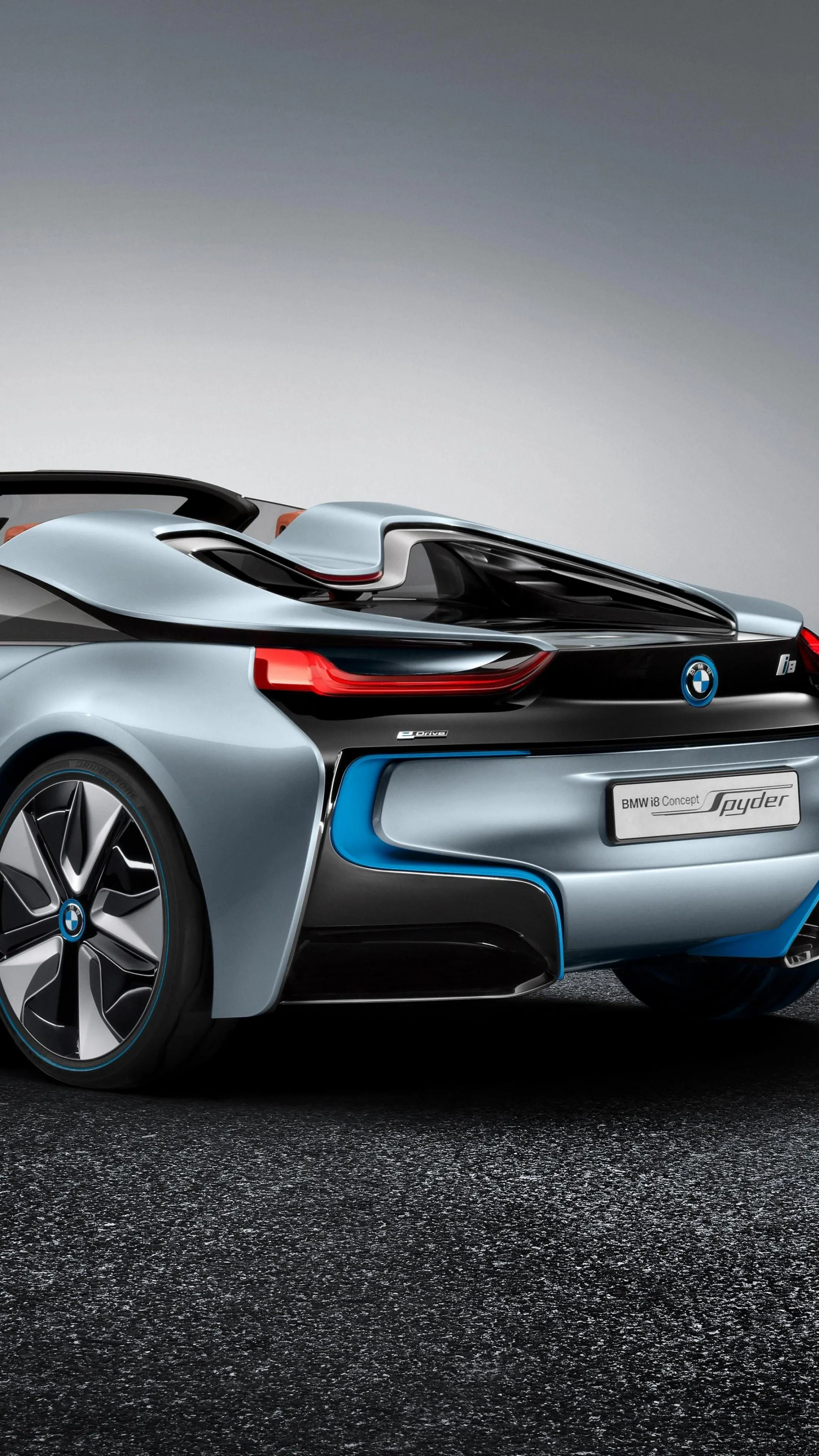 Rear View of Futuristic Silver Bmw on Curved Asphalt Road