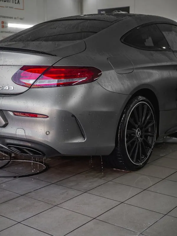 Rear View of Grey Mercedes Coupe Inside Car Wash Wallpaper