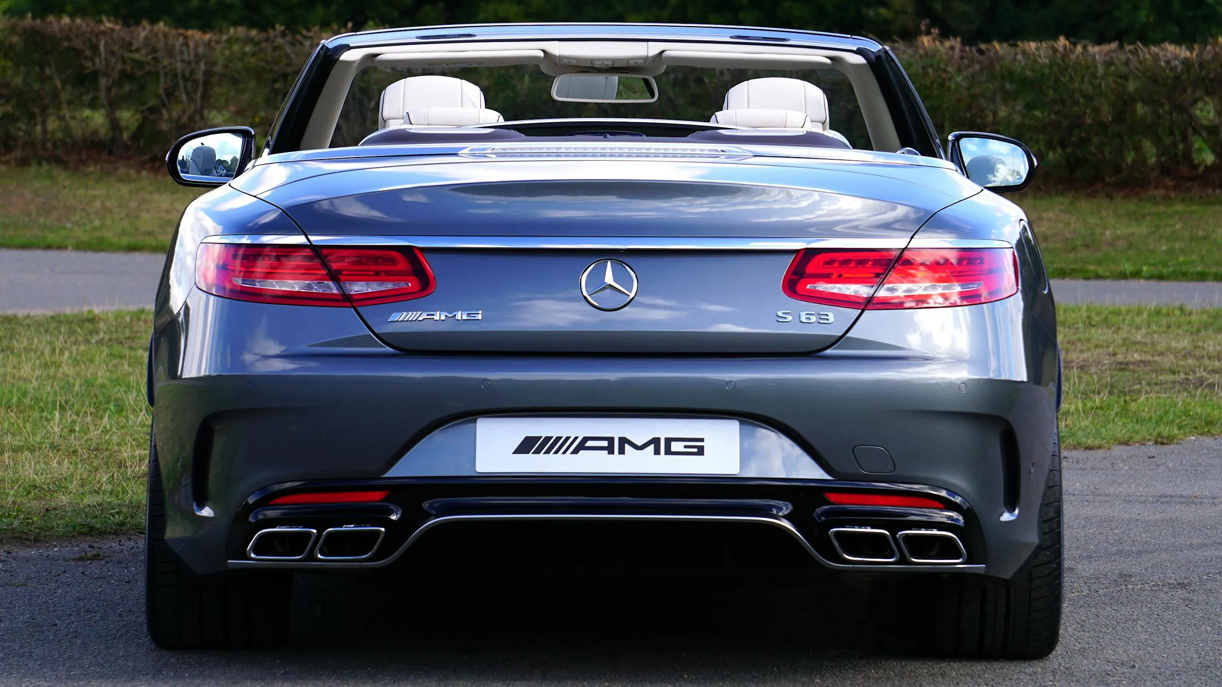 Rear View of Mercedes AMG Convertible on Pavement free image