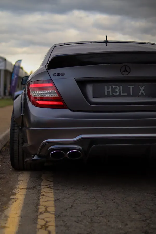 Rear View of Mercedes Benz C63 AMG on Road Wallpaper