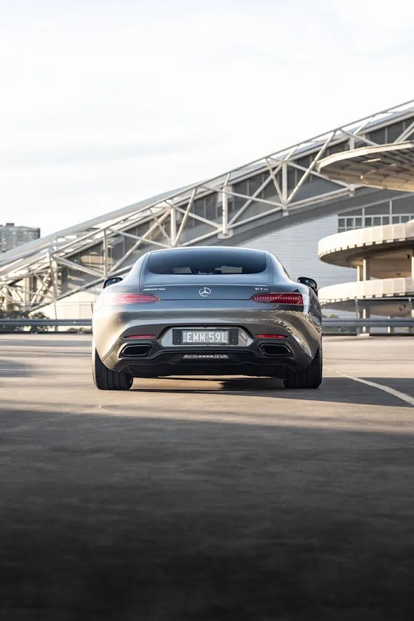 Rear View of Mercedes Benz Coupe at a Stadium Wallpaper