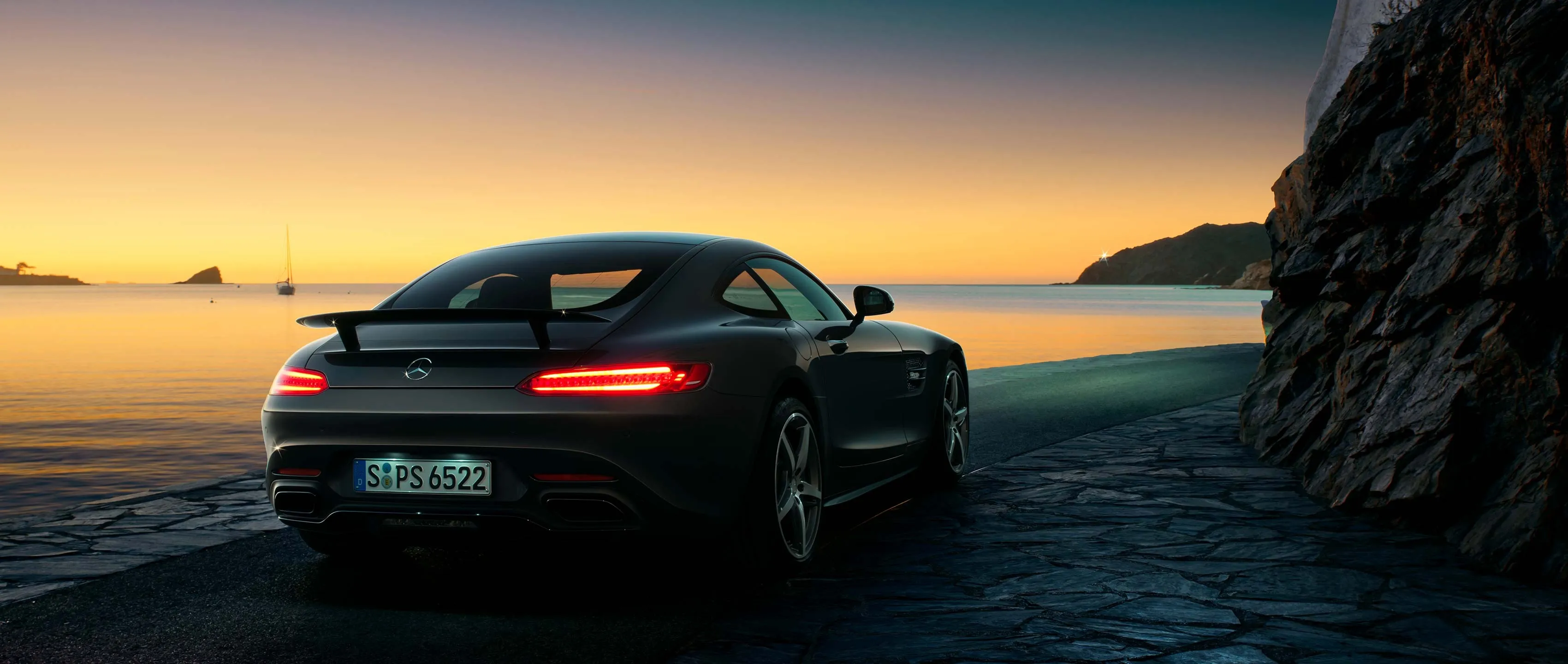 Rear View of Mercedes Benz Coupe at Oceanfront Sunset
