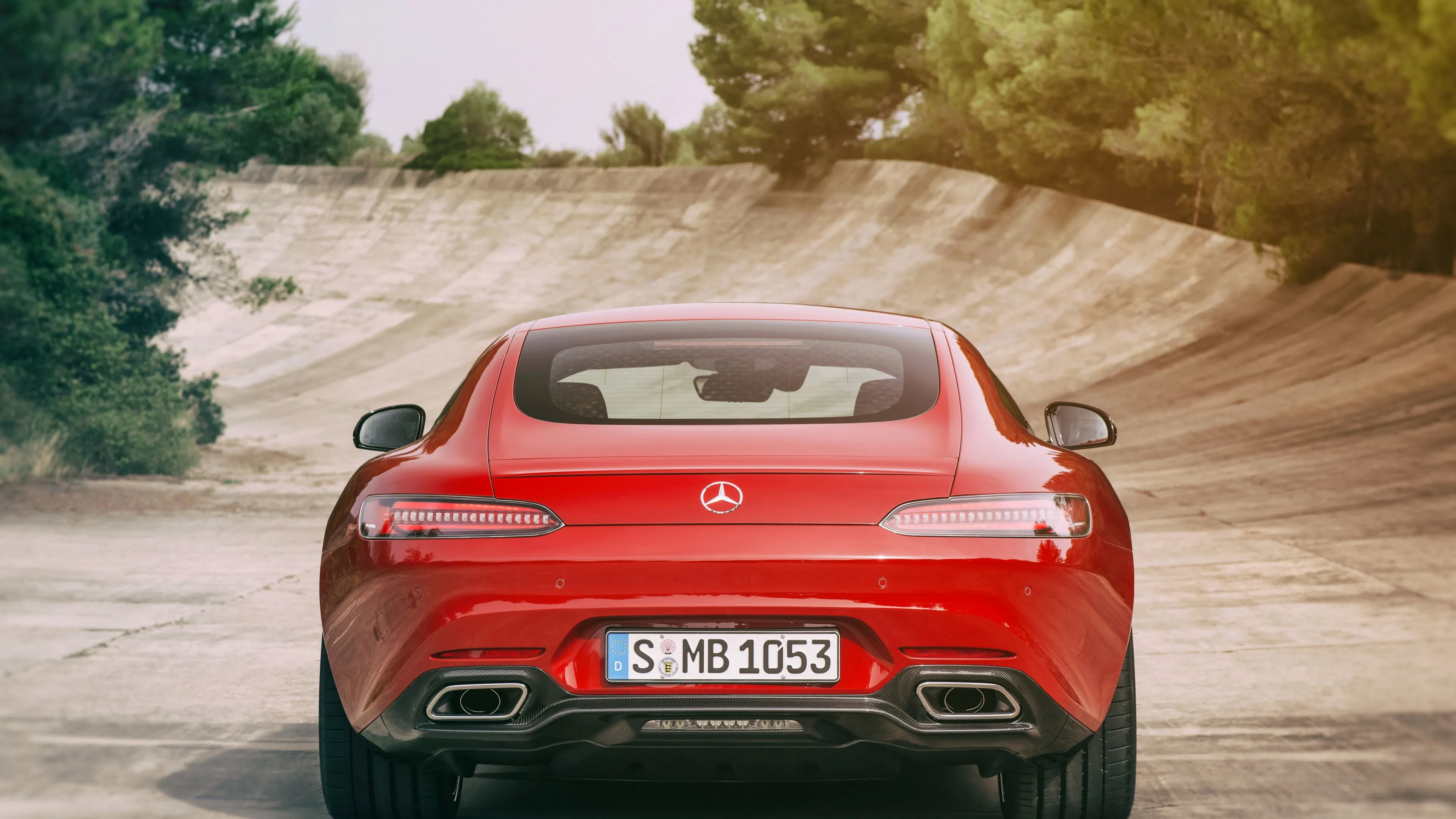 Rear View of Mercedes Benz Sports Car on Curved Road