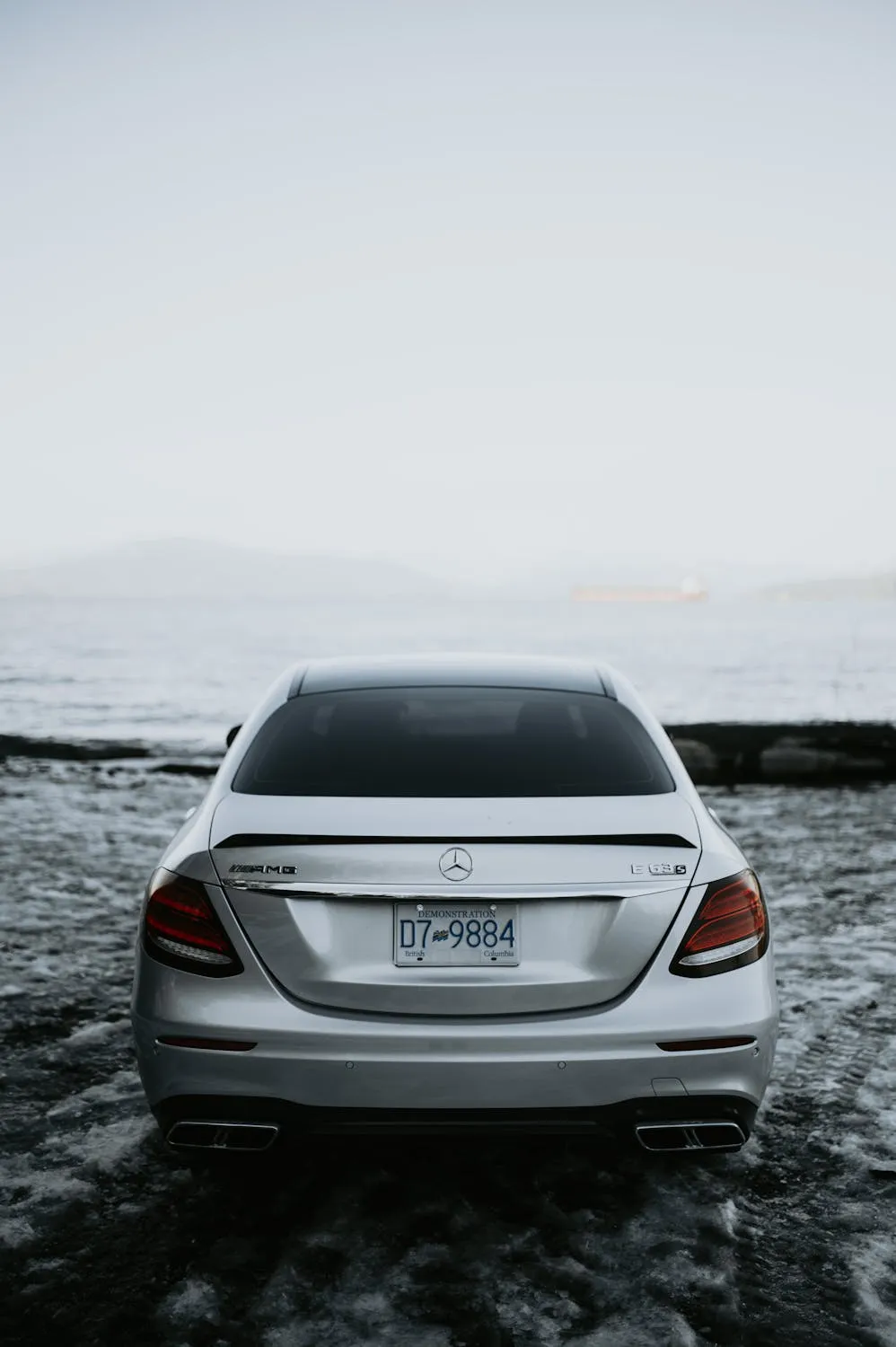 Rear View of Mercedes by Ocean With Moody Sky Wallpaper
