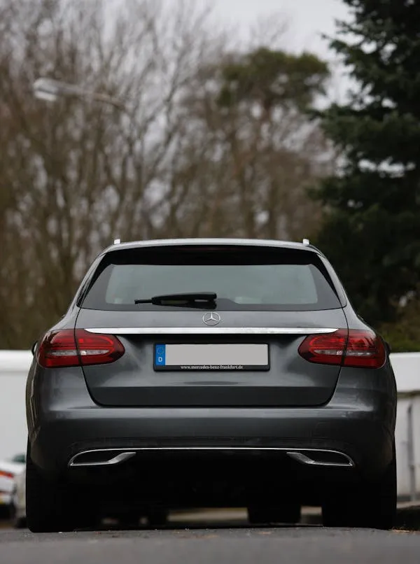 Rear View of Modern Mercedes SUV Parked on Pavement