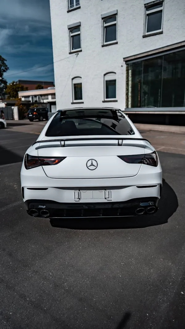 Rear View of White Mercedes Benz on City Street image