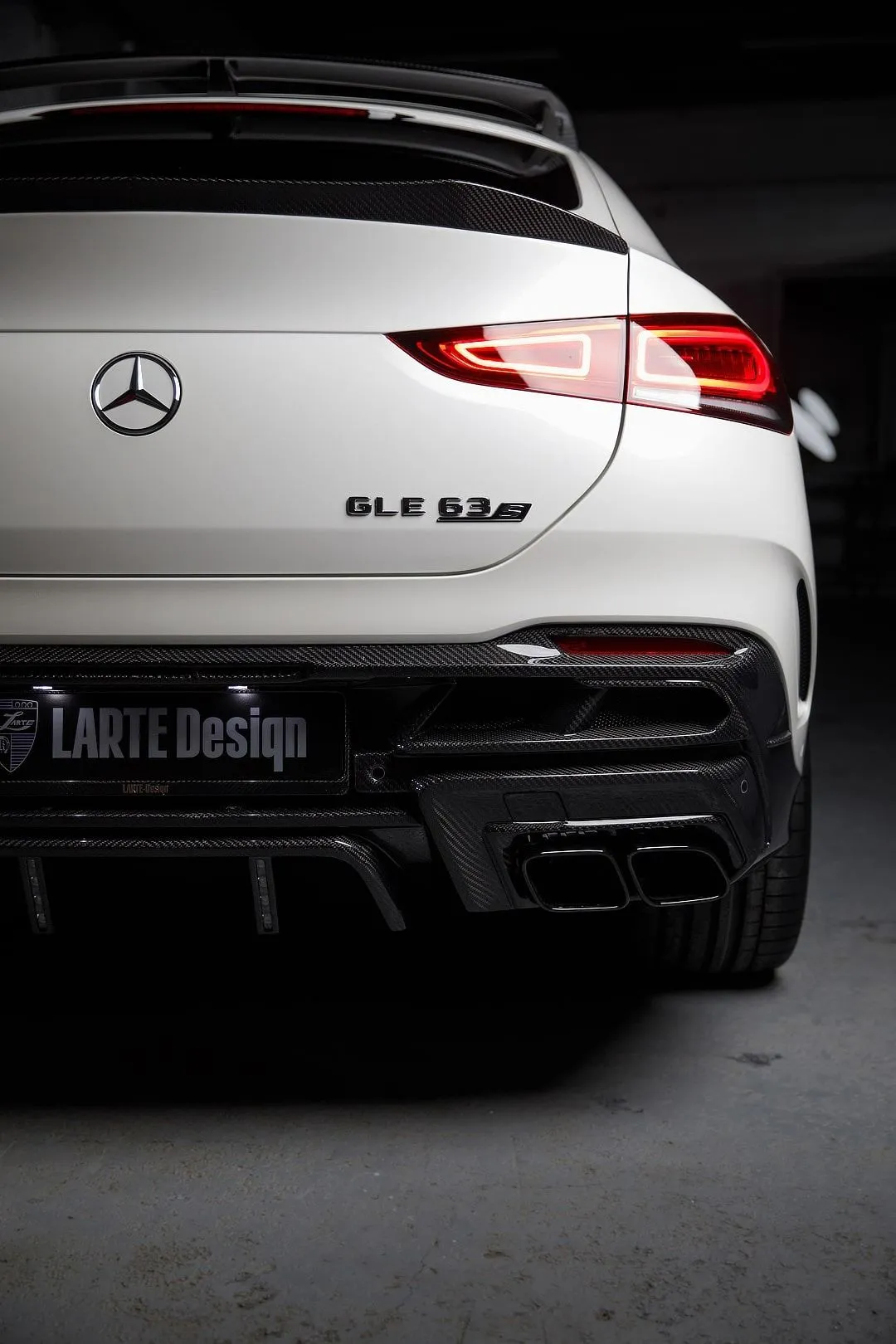 Rear View of White Mercedes GLE Coupe in Garage Wallpaper