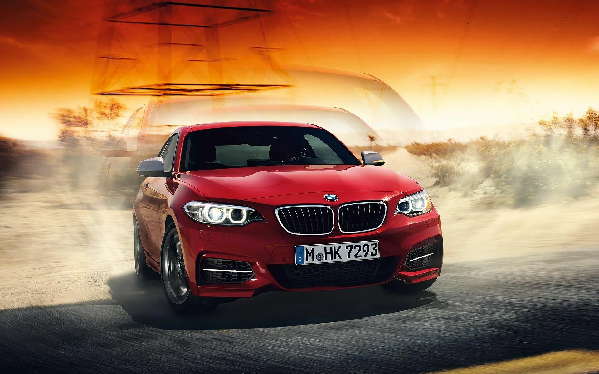 Red Bmw Car Drifting on a Track with Smoke Wallpaper