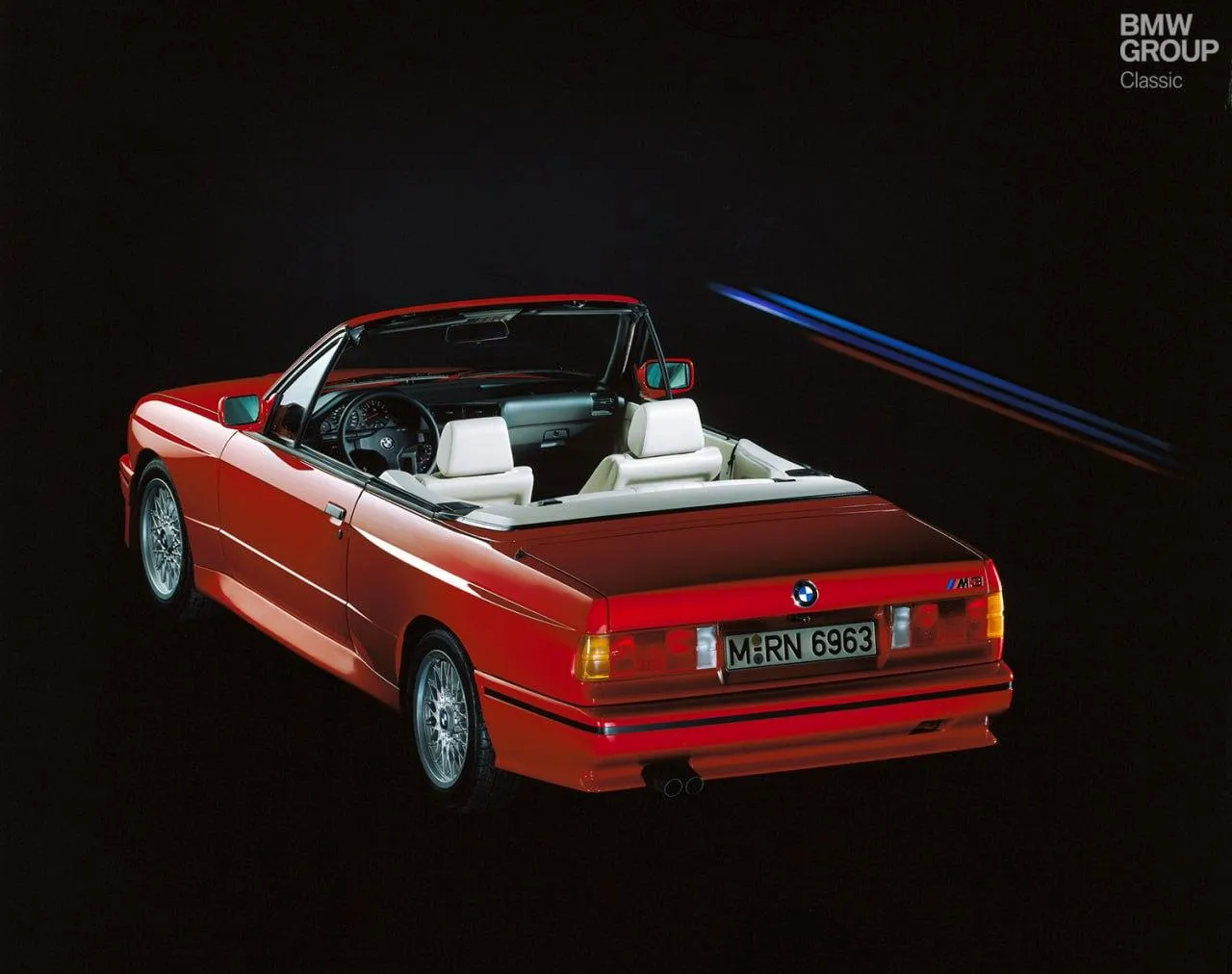 Red Bmw Convertible Rendered on Black Background Wallpaper