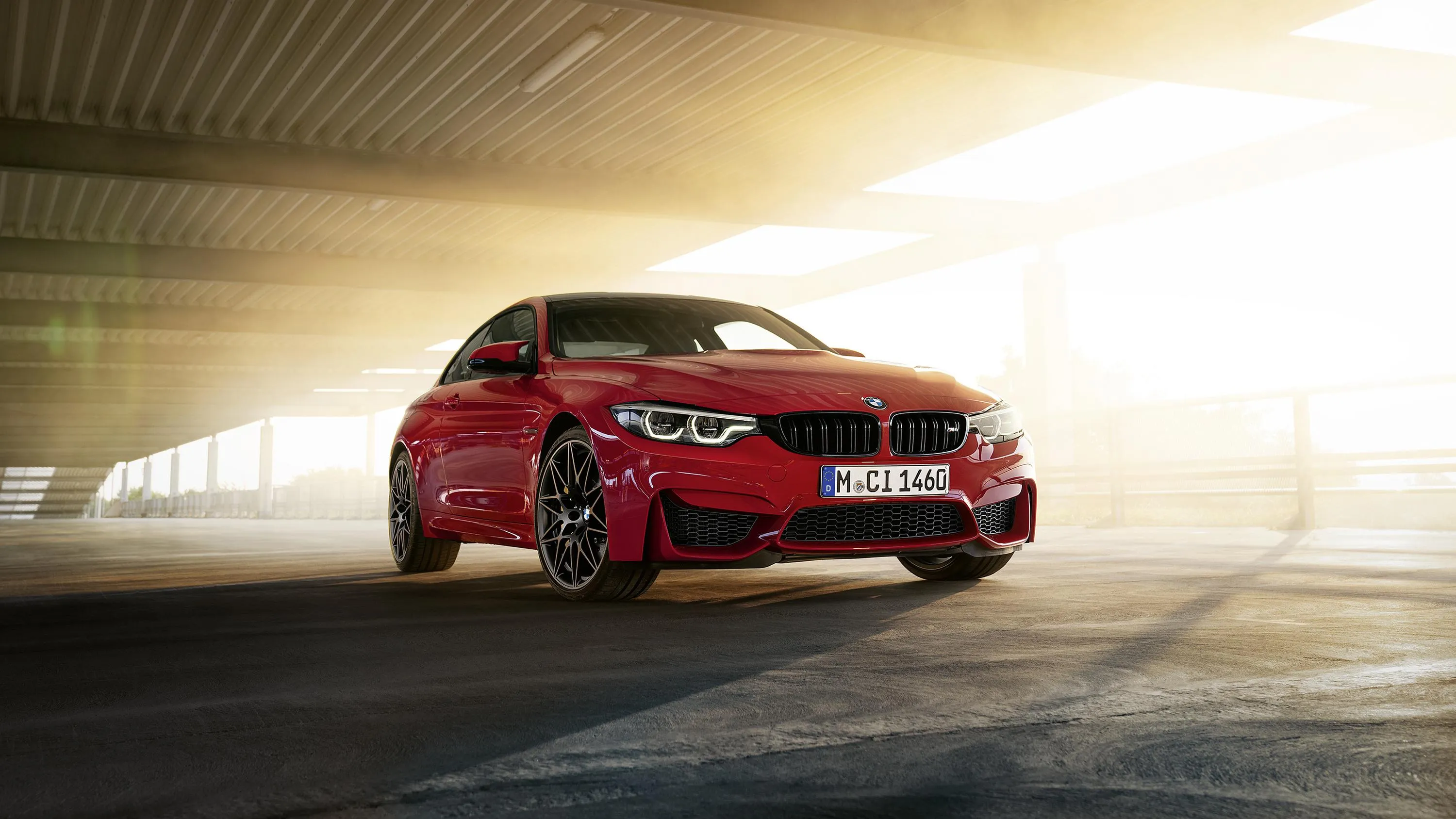Red Bmw Coupe Racing Through a Dimly Lit Tunnel Image