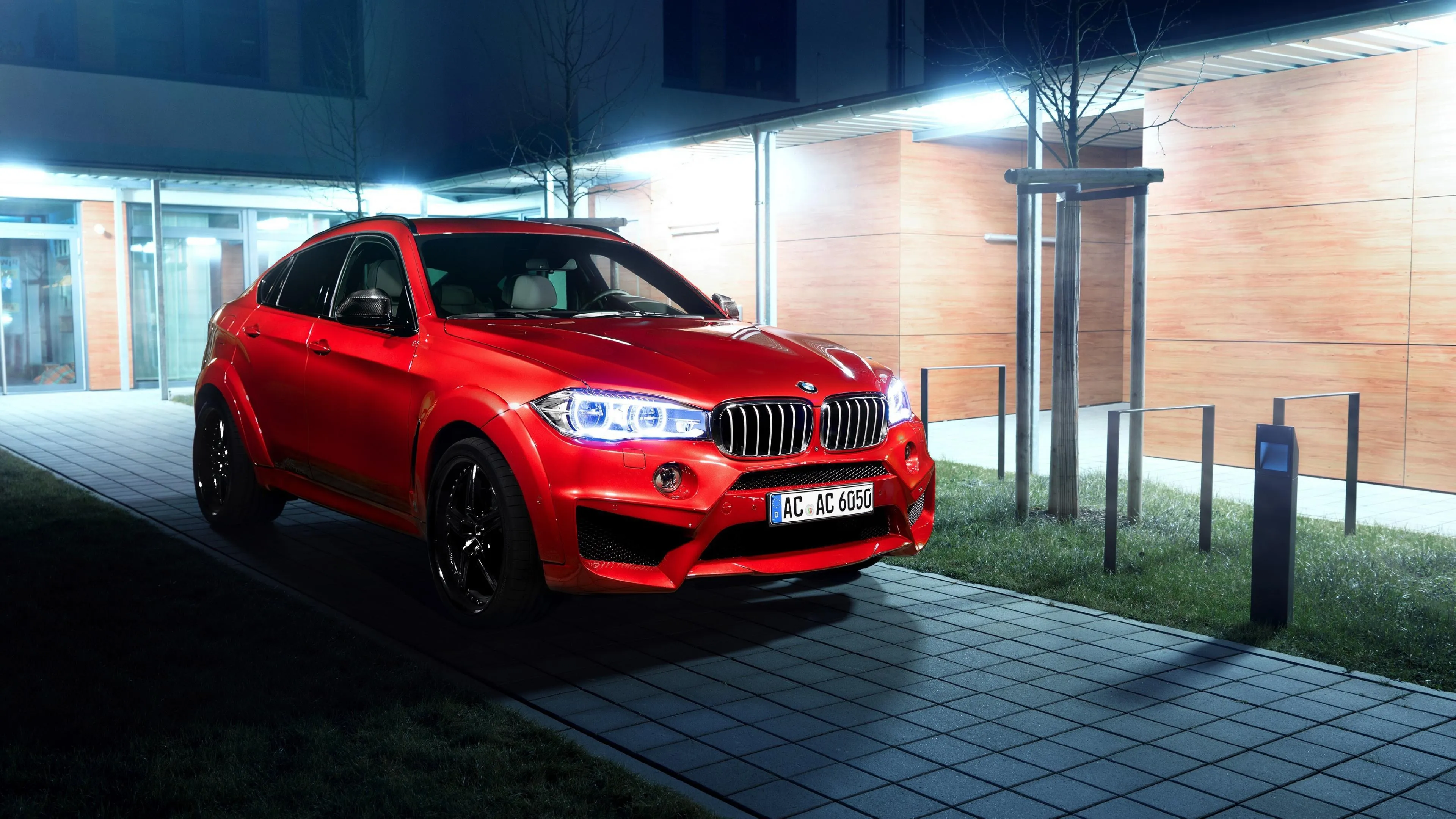Red Bmw Crossover Car Parked in City at Night Time Wallpaper