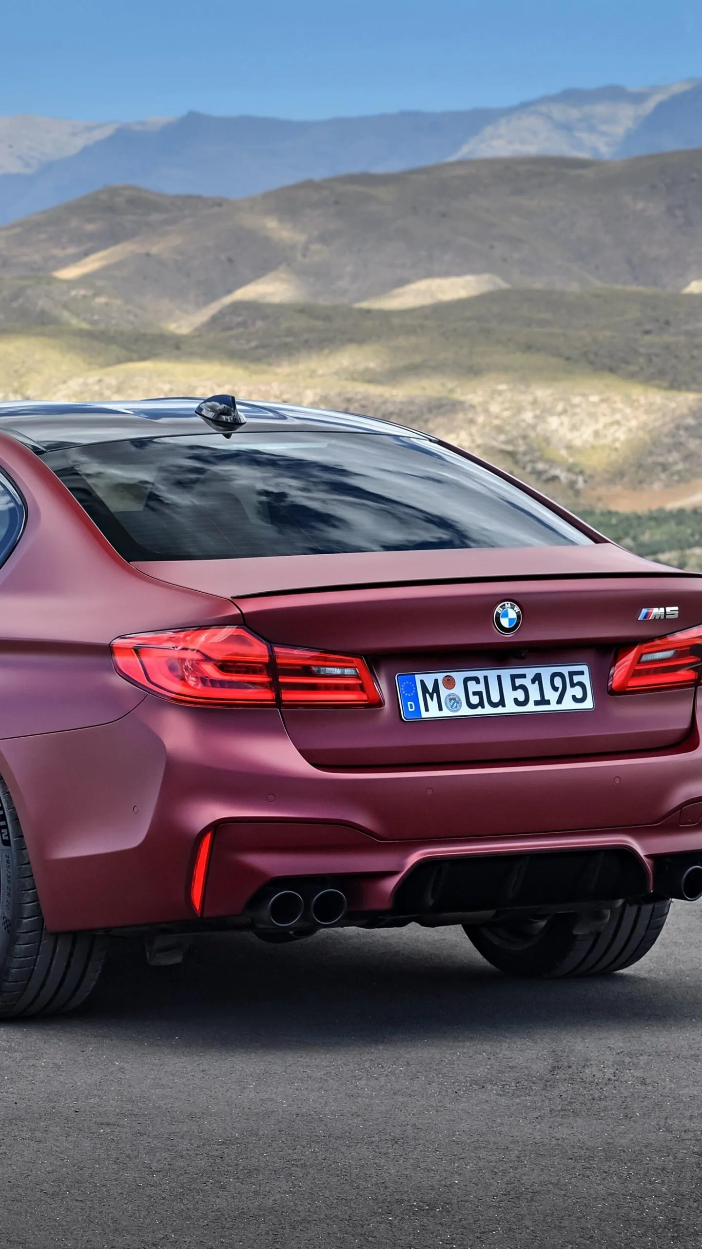 Red Bmw Driving in Mountains with a Powerful Look Wallpaper