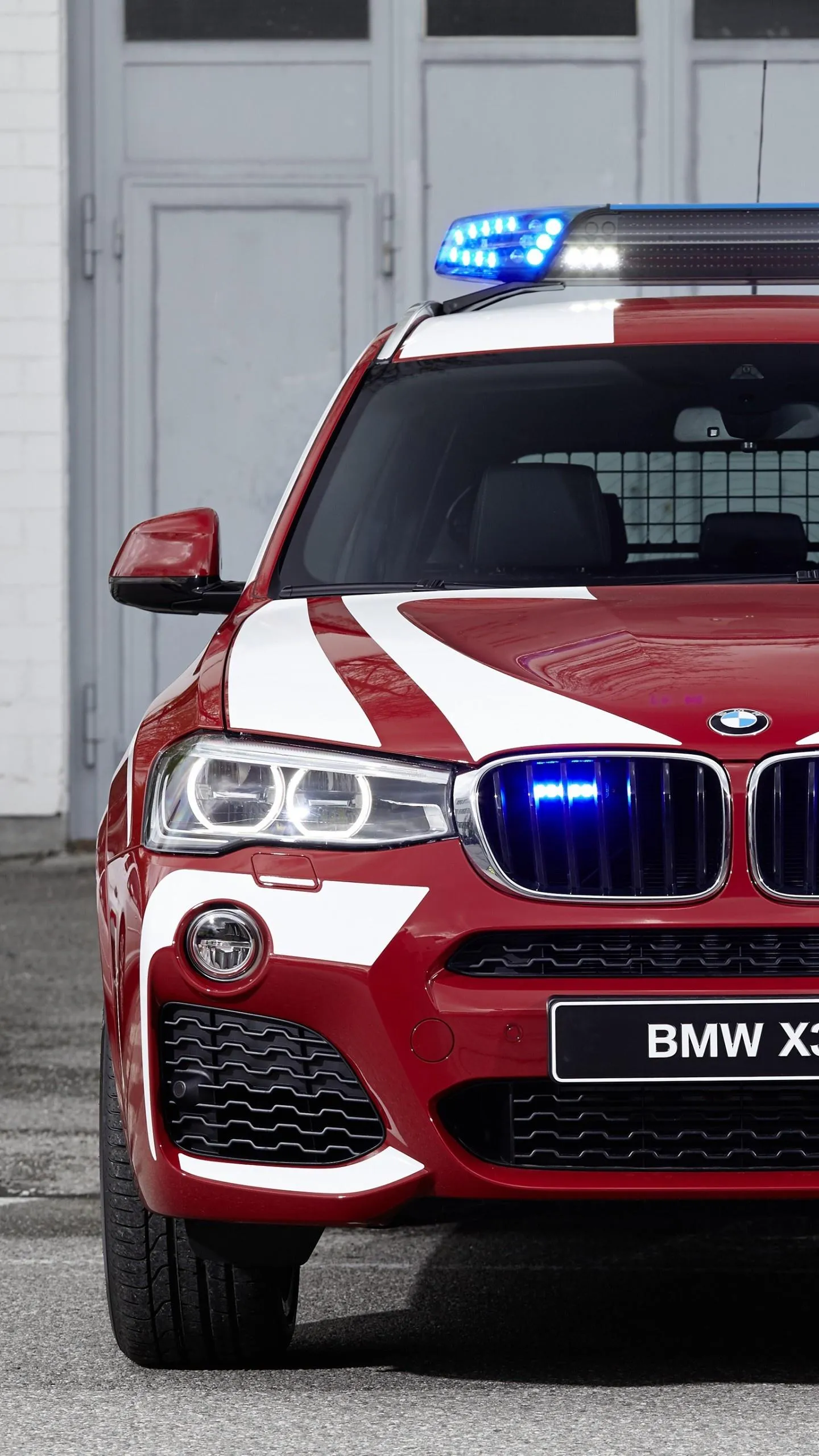 Red Bmw Emergency Vehicle with Flashing Lights on Wallpaper