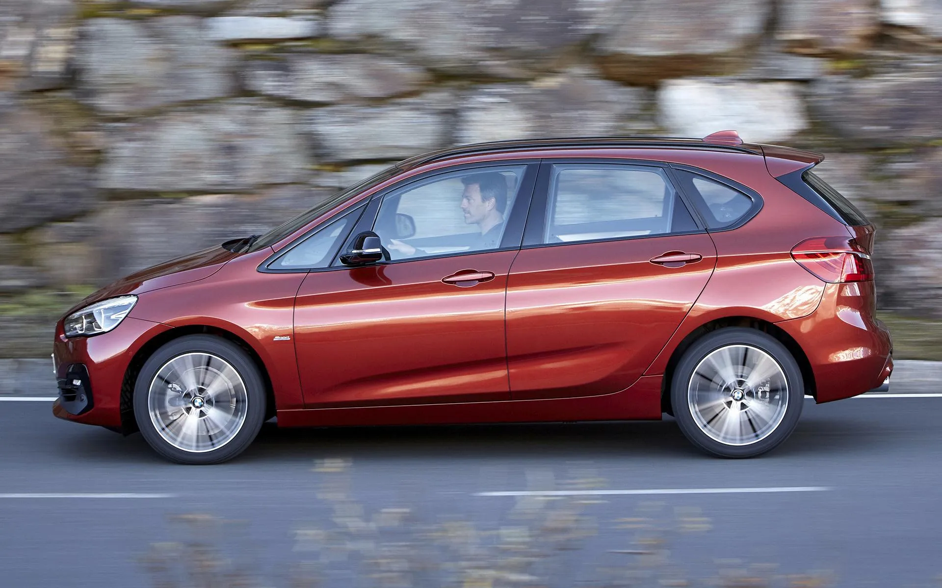 Red Bmw Hatchback Parked Near a Stone Wall Hd Wallpaper