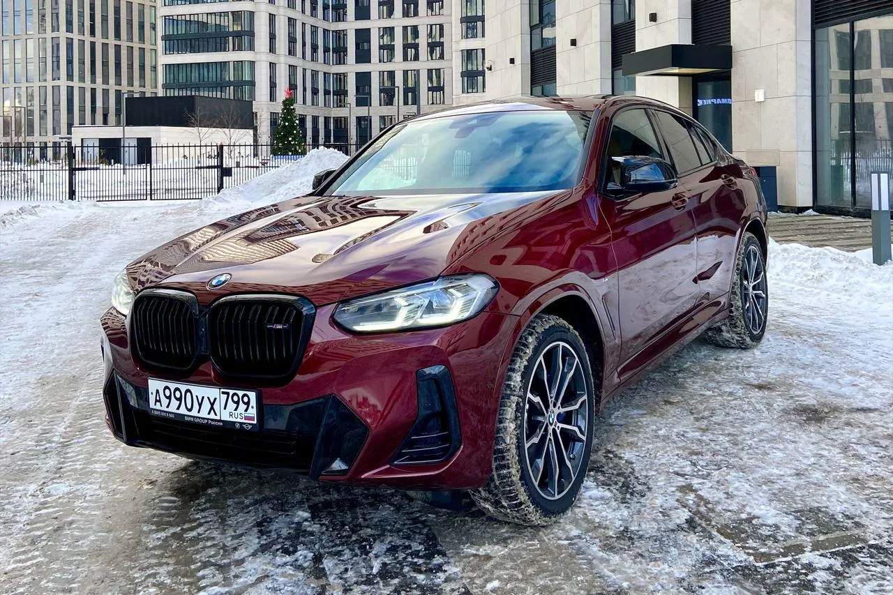 Red Bmw M Car Parked on Modern City Street in Winter