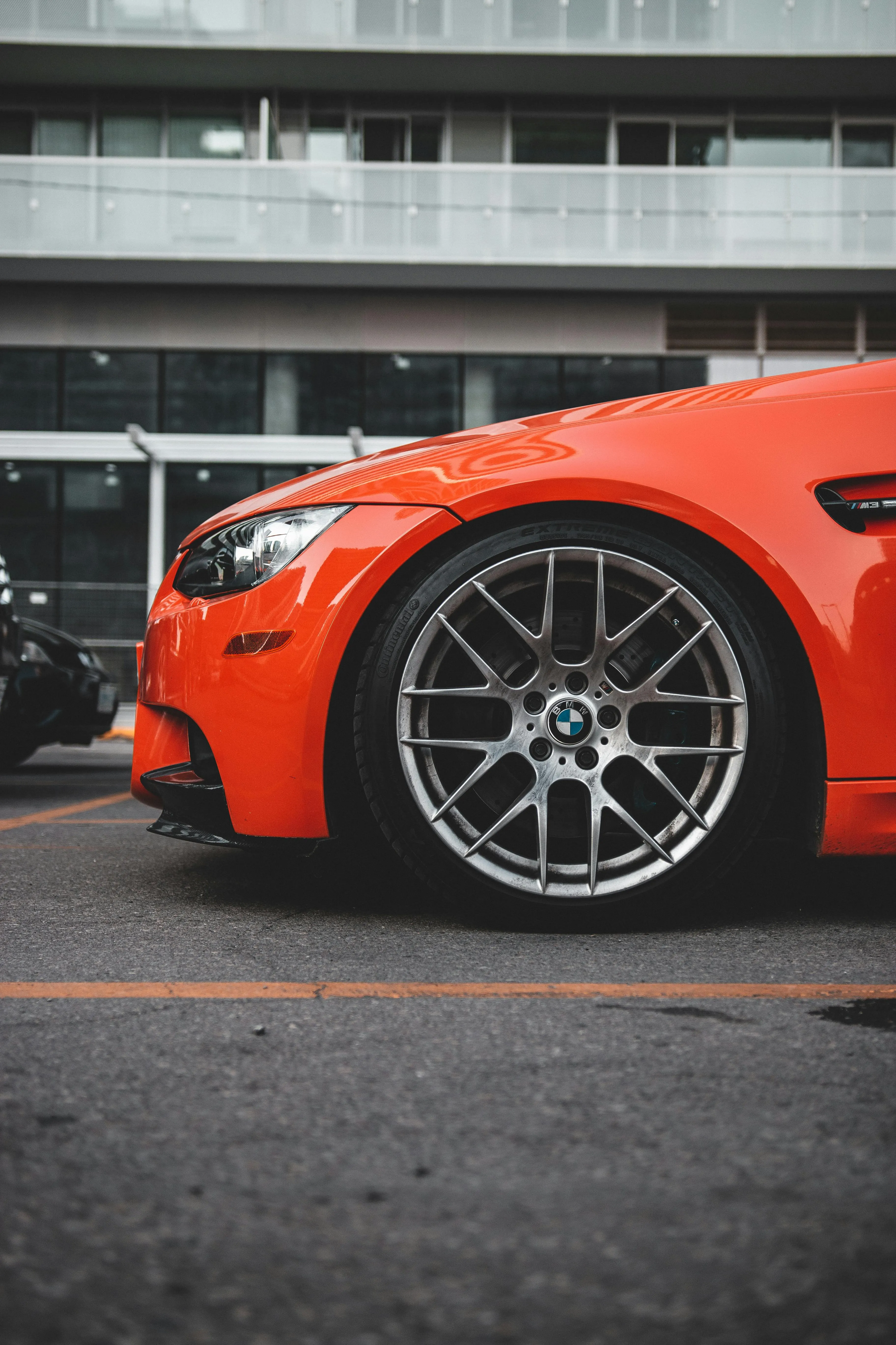 Red Bmw M Series with Silver Alloy Wheels Closeup Image