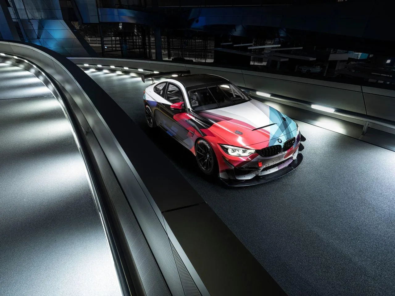 Red Bmw on a Futuristic Bridge Or Tunnel with Strong Lights