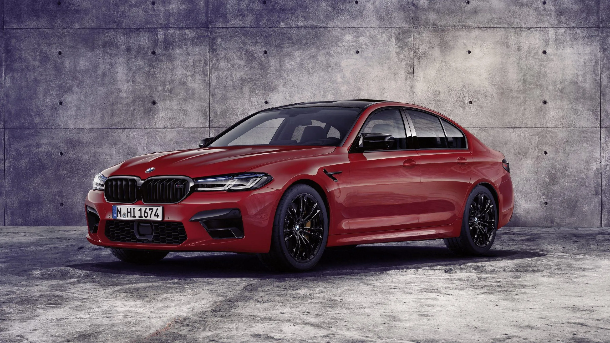 Red Bmw Sedan Parked in Garage with Concrete Walls