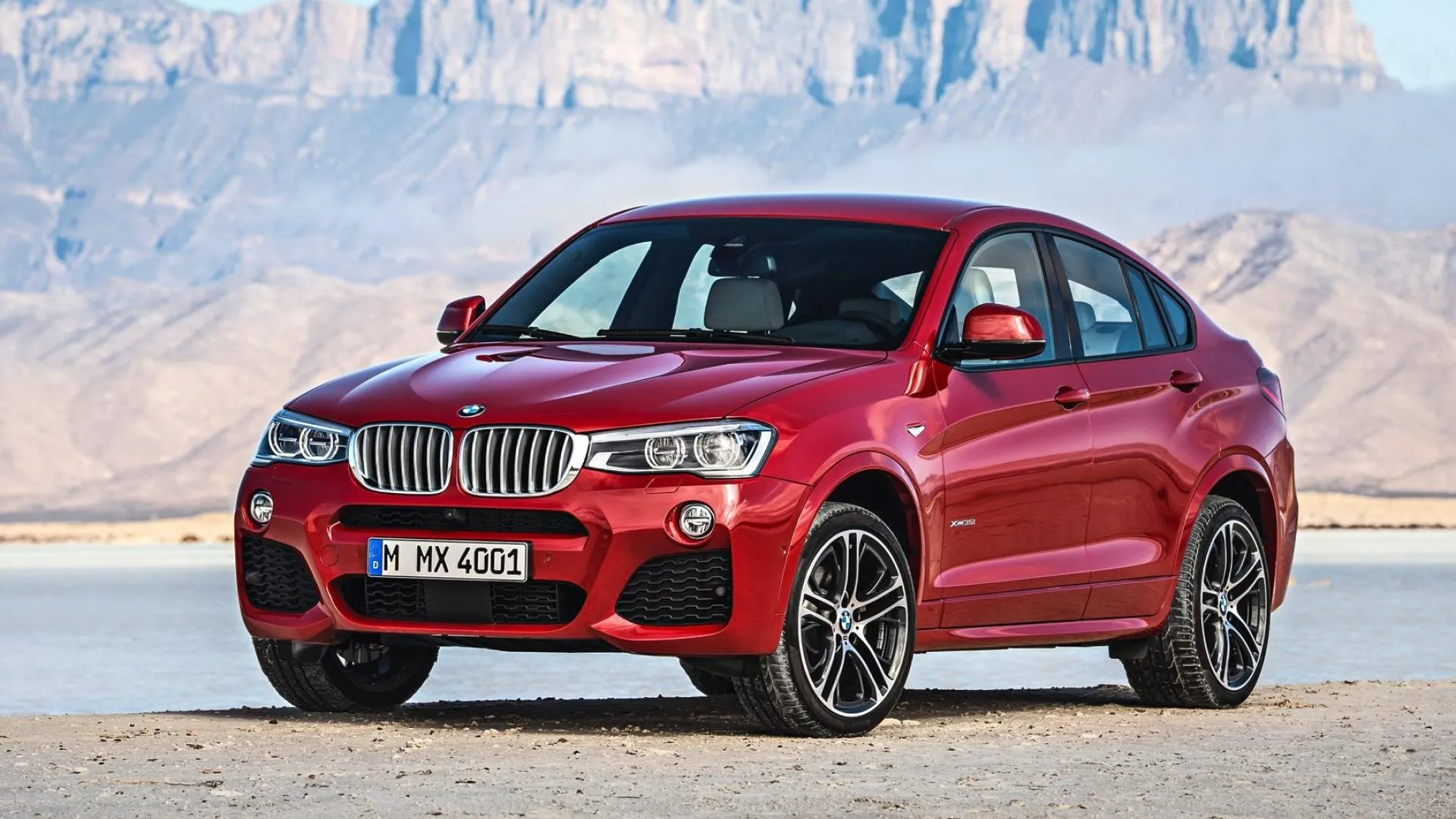 Red Bmw X4 Parked on Roadside Near Rocky Mountains Hd