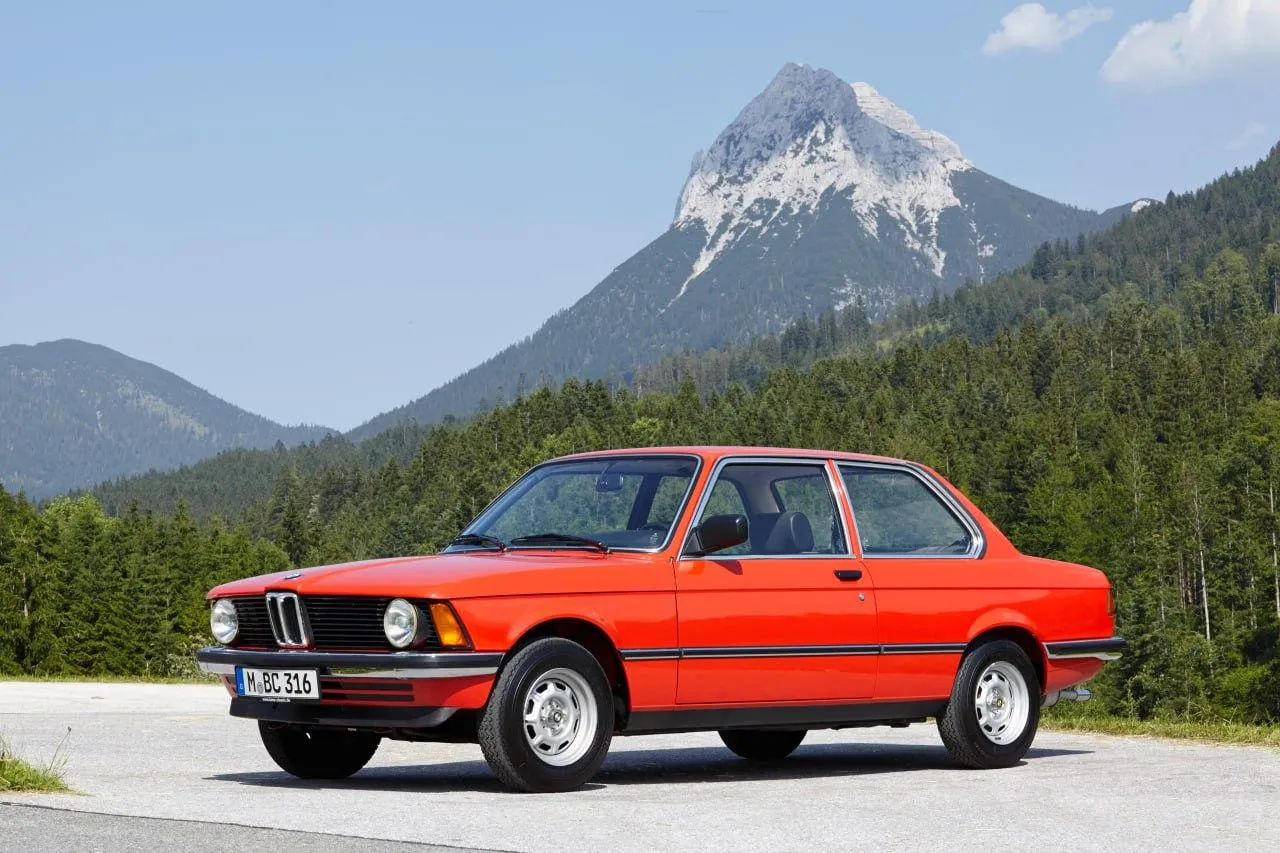 Red Classic Bmw Car Parked with Mountain in Background