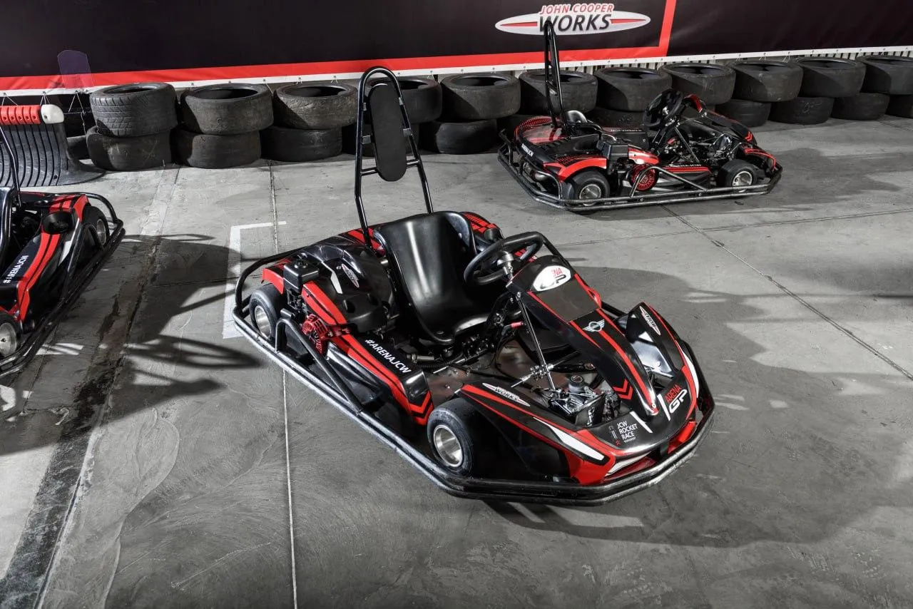 Red Go Kart Styled Bmw Vehicle Parked in Indoor Racing Track