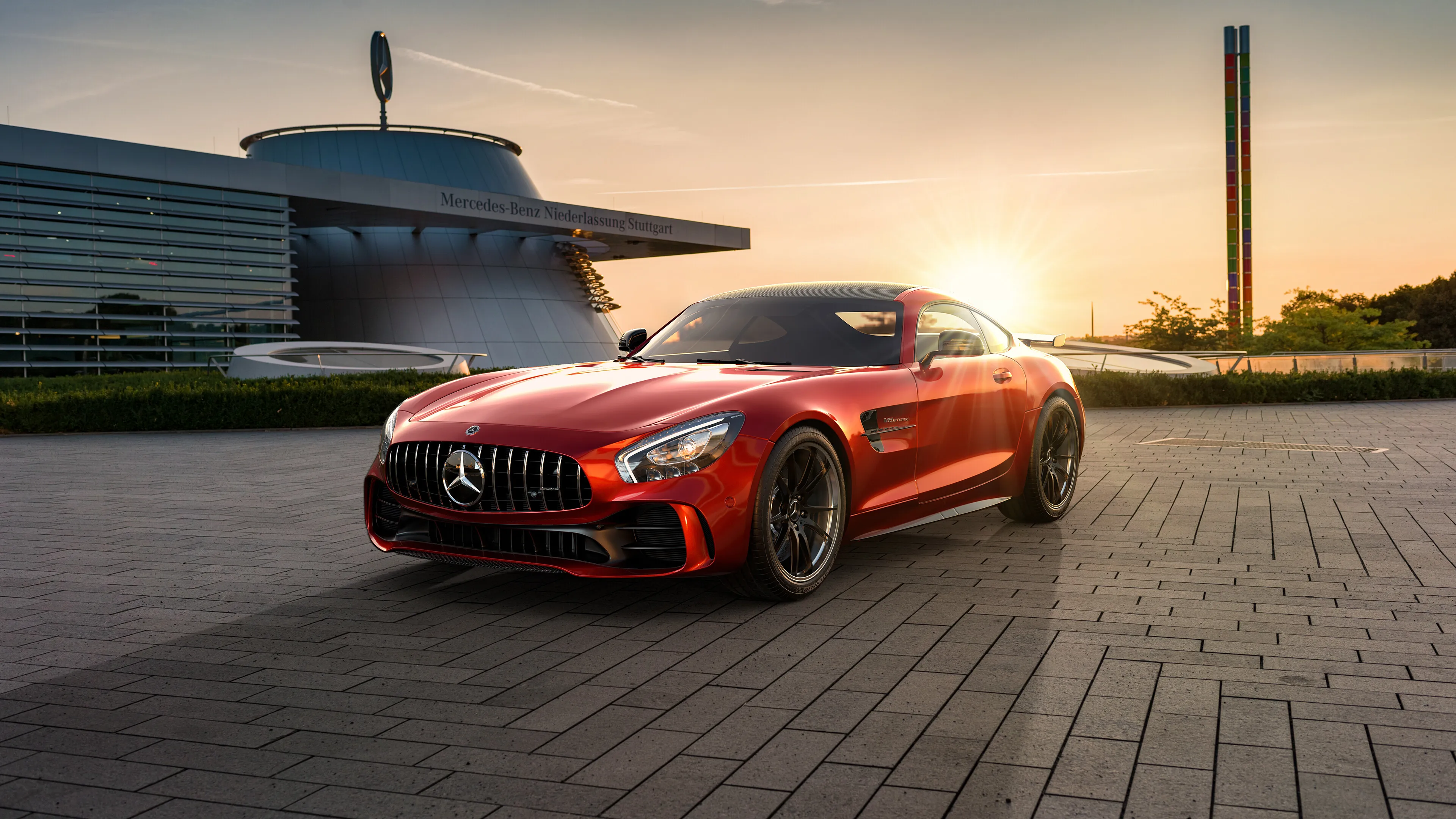 Red Mercedes AMG Posed Outside Modern City Architecture