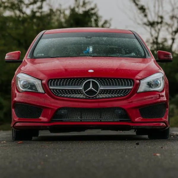Red Mercedes Benz Captured from the Front in Daylight