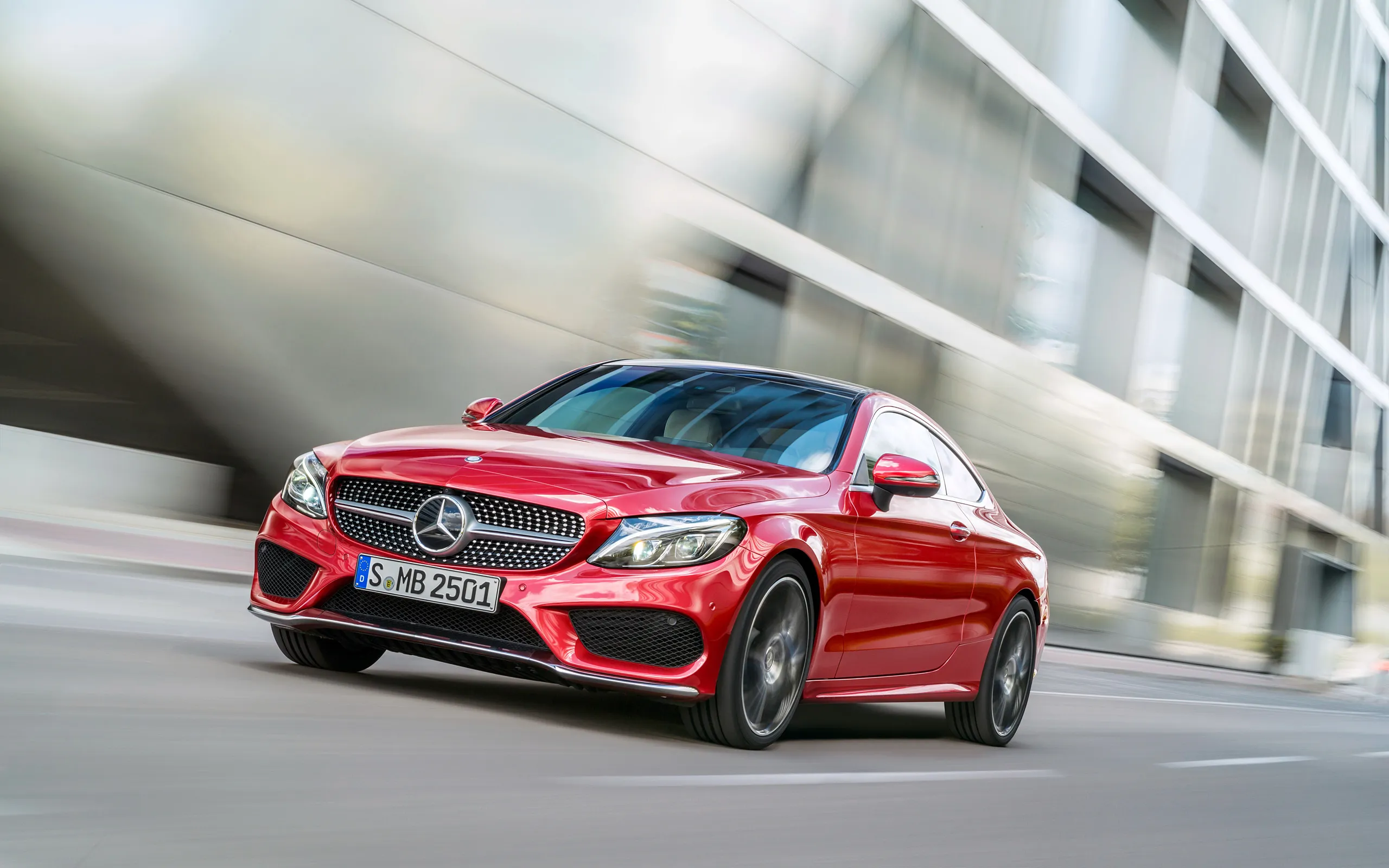 Red Mercedes Benz Sedan Driving Fast in City Environment
