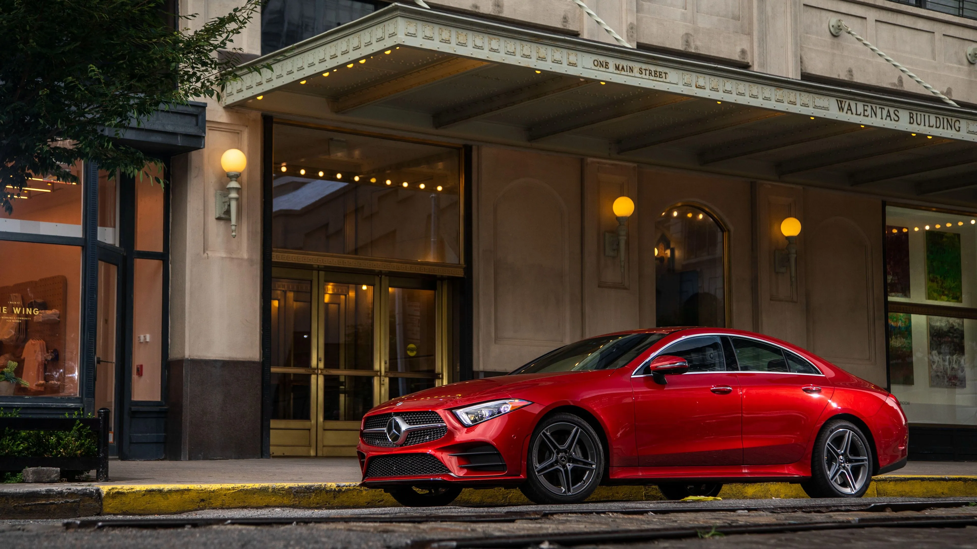 Red Mercedes Benz Sedan Parked in Front of Cafe image