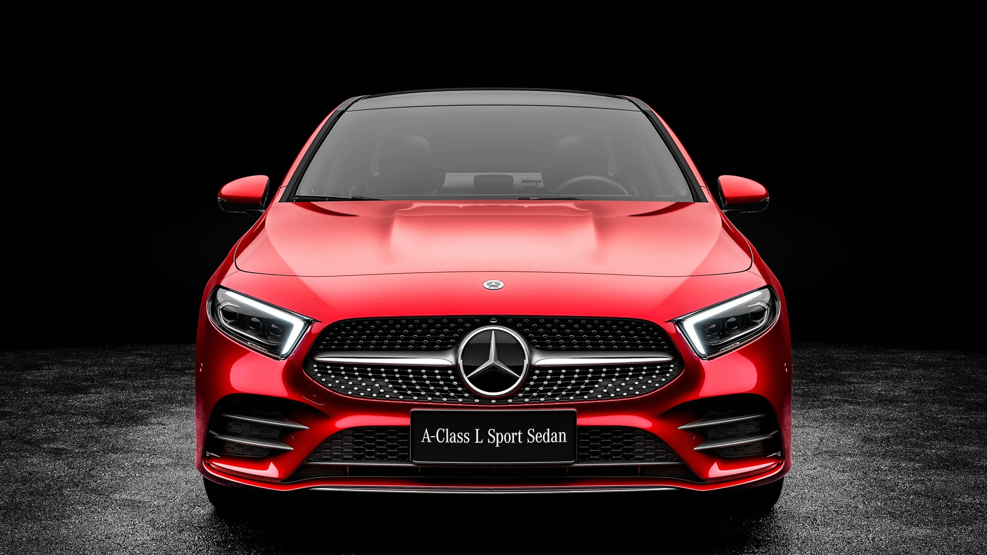 Red Mercedes Benz Sporty Sedan Front View on Black