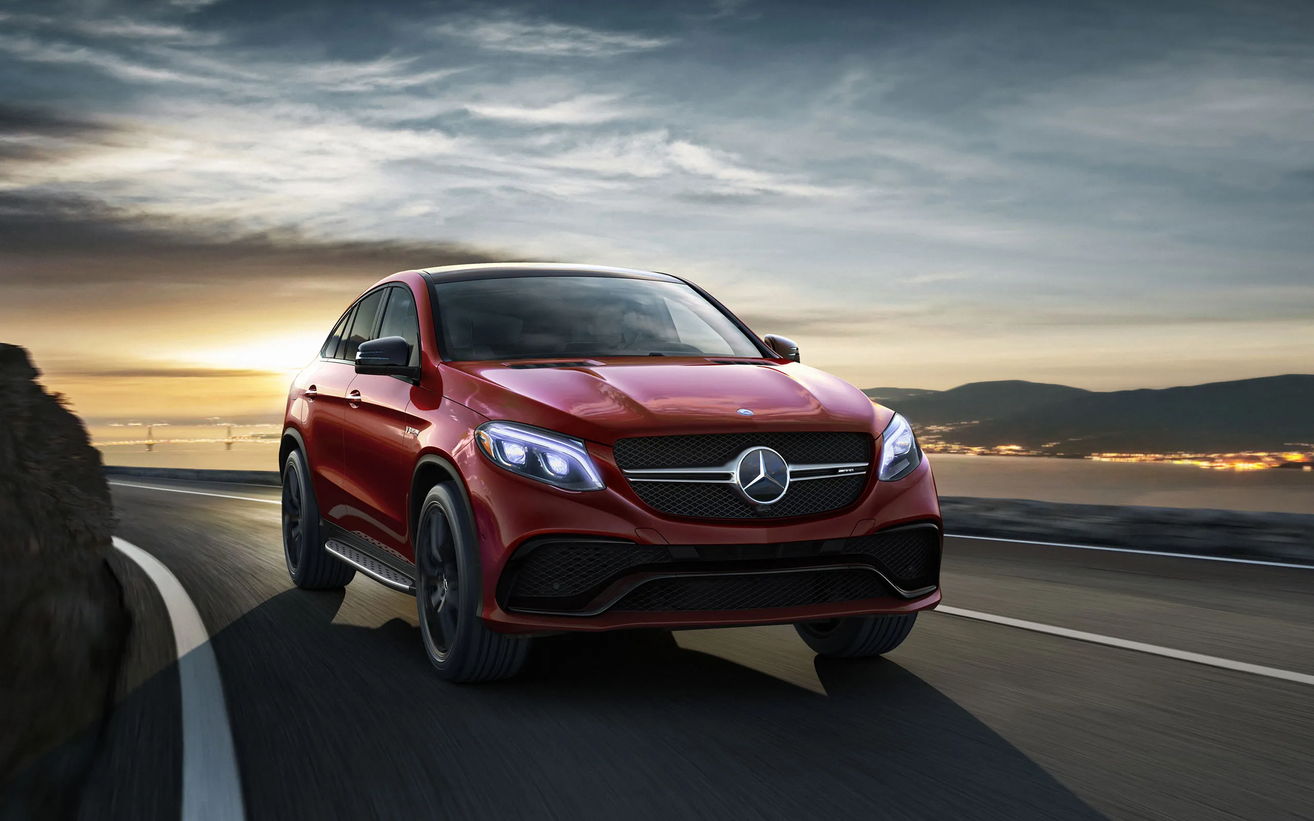 Red Mercedes Benz SUV Driving on Mountain Road Wallpaper