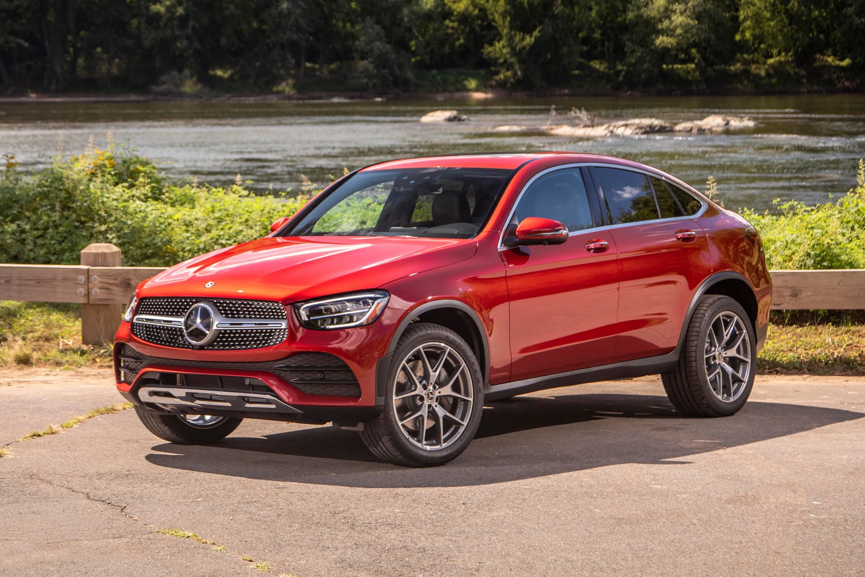 Red Mercedes Benz SUV Parked on Asphalt Near Trees image