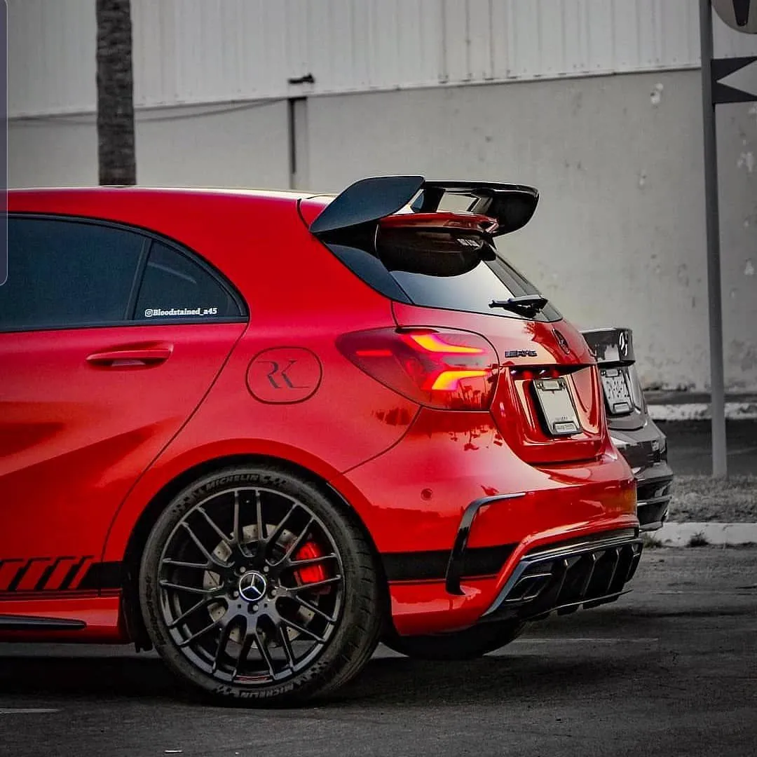 Red Mercedes Benz with Spoiler in Urban Parking Area