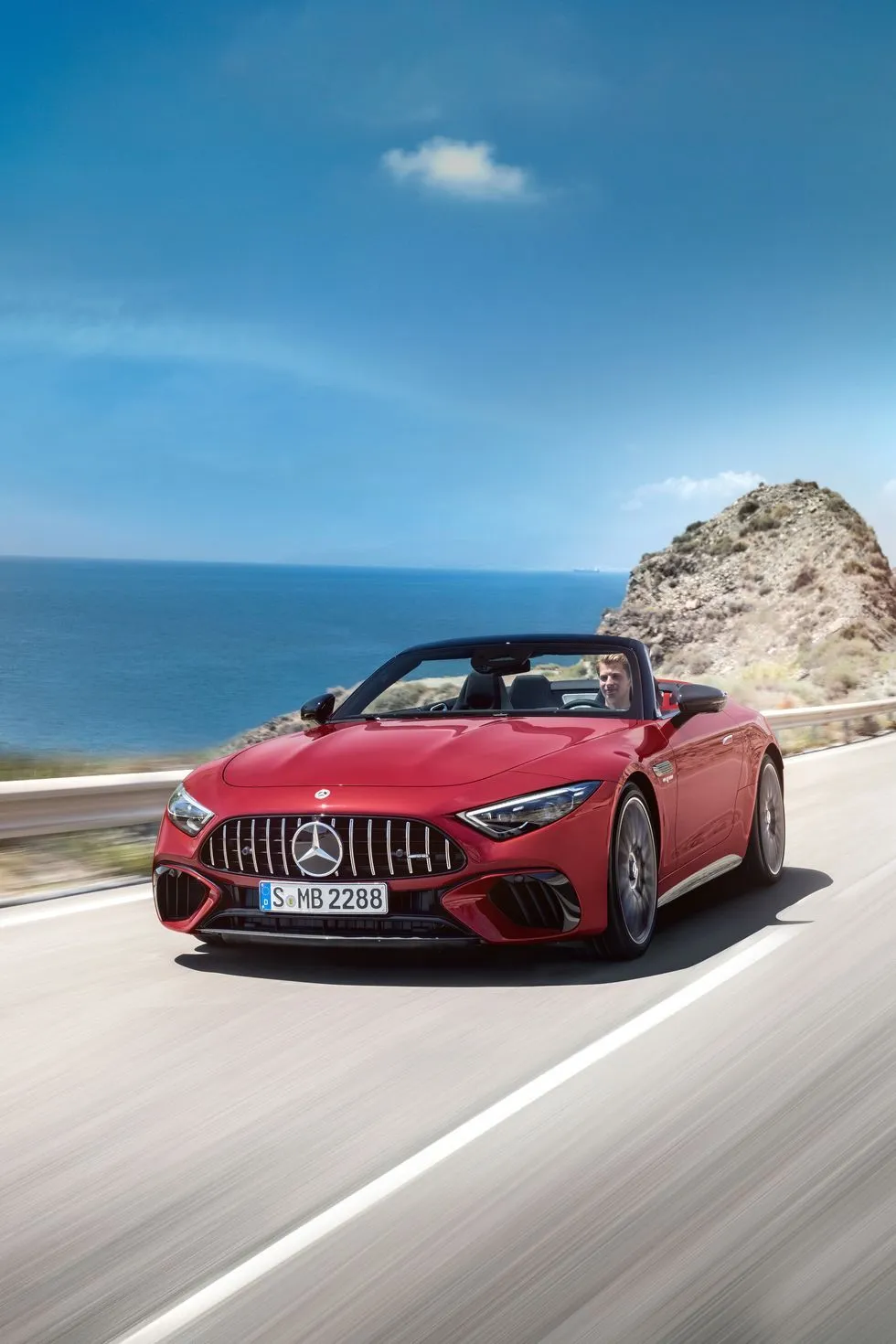 Red Mercedes Convertible Driving Along Coastal Highway