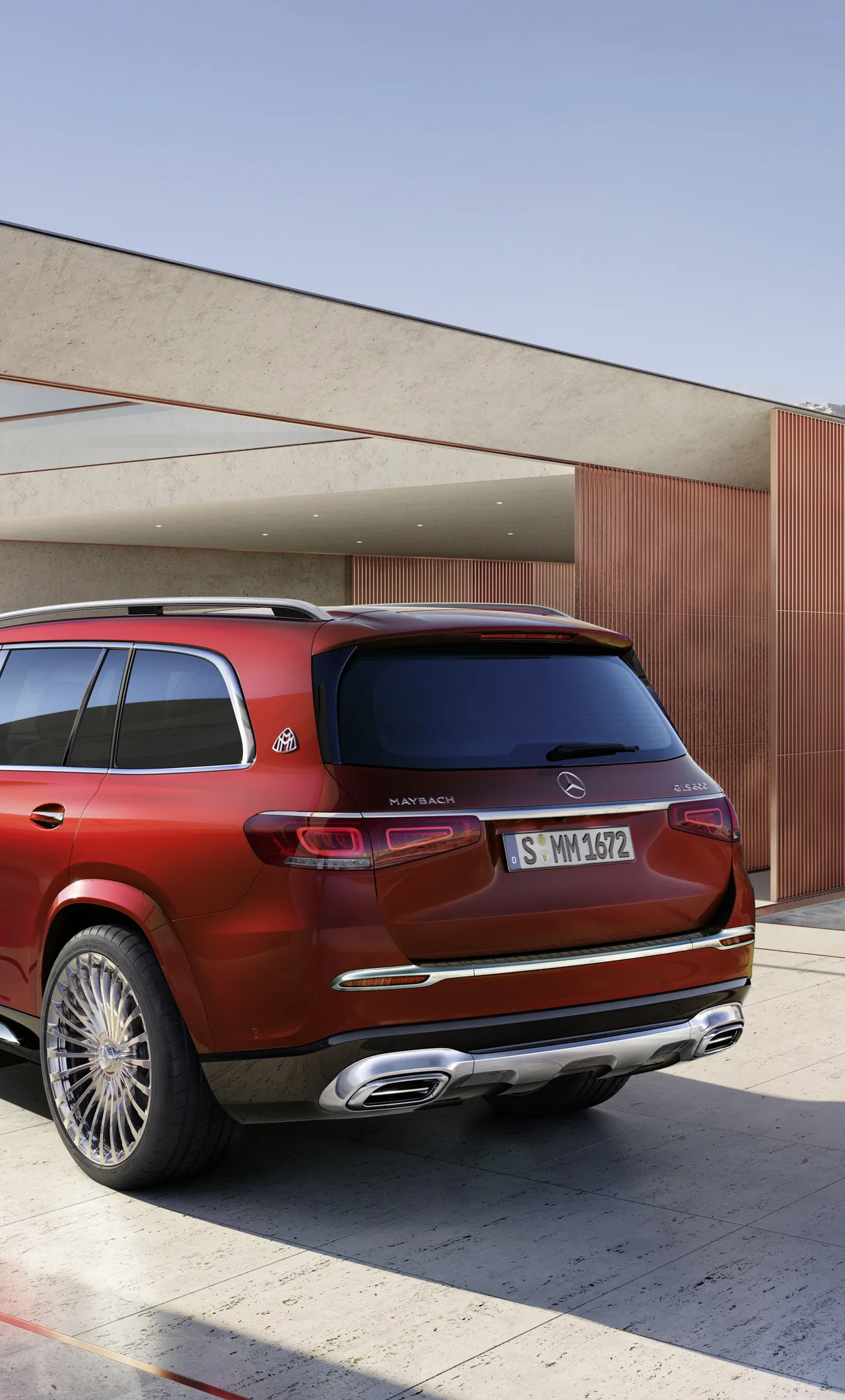 Red Mercedes SUV Parked Near Concrete Building Wallpaper