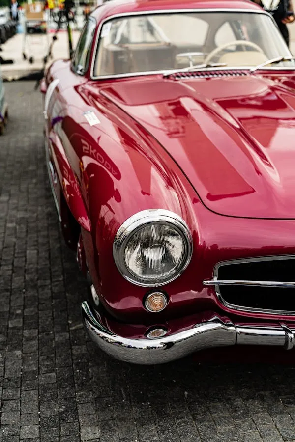 Red Vintage Mercedes Sports Car on Display Street Wallpaper